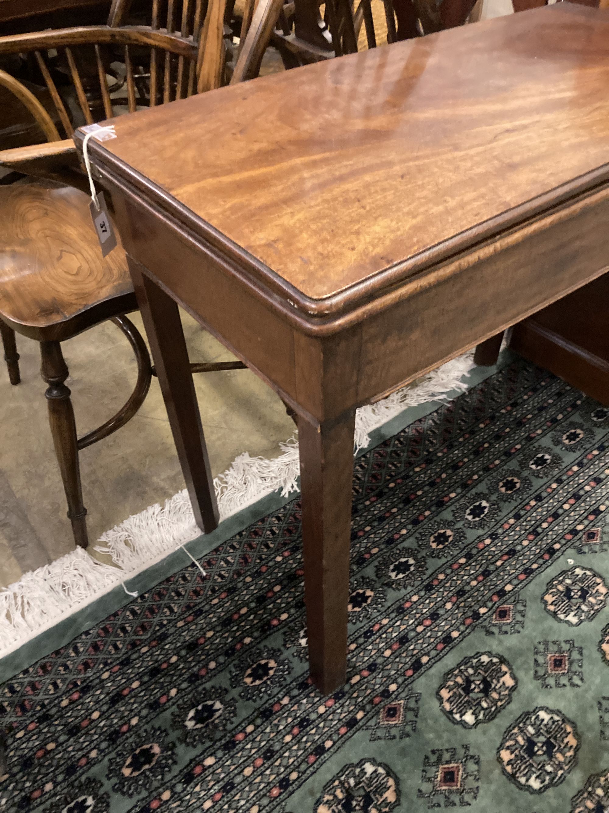 A George III mahogany folding rectangular card table, width 90cm depth 44cm height 74cm